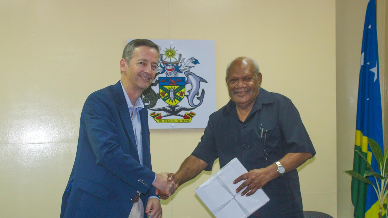 President of the Legislative Council of New South Wales Parliament Hon. Matthew Mason Cox exchange gifts with the Speaker of the National Parliament of Solomon Islands Hon. John Patteson Oti at the Speaker’s Lounge.
