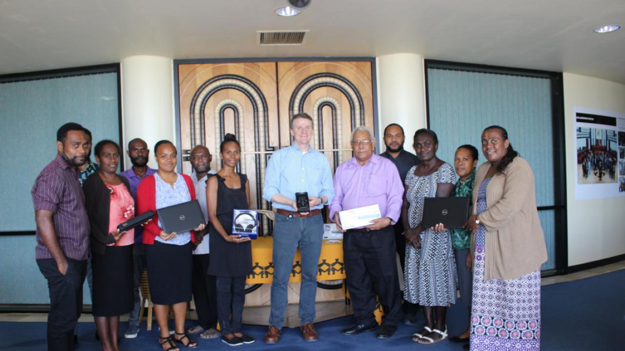 HE. Roderick Brazier (center) and staff of the National Parliament Office during the short handing over ceremony at the National Parliament House, Honiara.